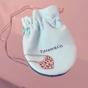 Lovely necklace with tree branches inside heart